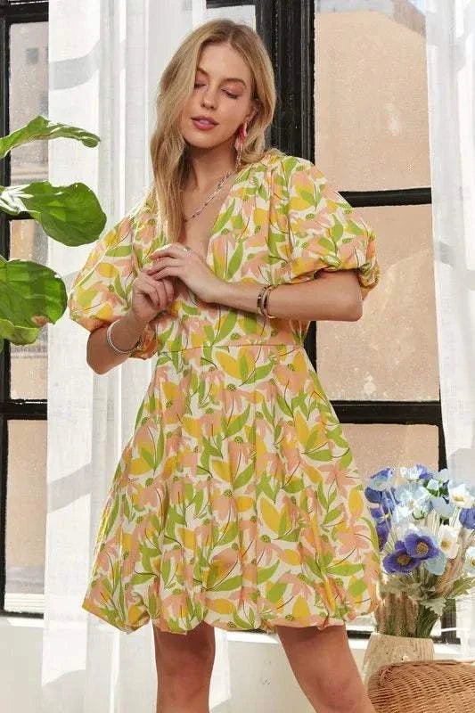 The Sunlit Petal DressSoft and luminous, The Sunlit Petal Dress captures the lightness of a warm morning in full bloom. Featuring puff sleeves, a softly flared mini silhouette, and a vibrMini DressesThe Sunlit Petal Dress