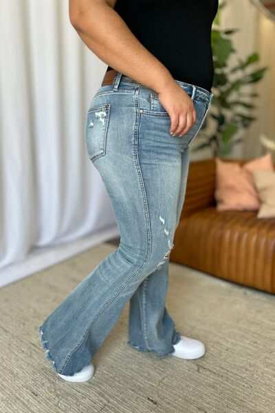 Judy Blue Medium Rise Tummy Control Destroyed FlareThe medium rise tummy control destroy flare jeans are designed to enhance your silhouette while providing ultimate comfort. Featuring a flattering fit, these jeans oFlare JeansJudy Blue Medium Rise