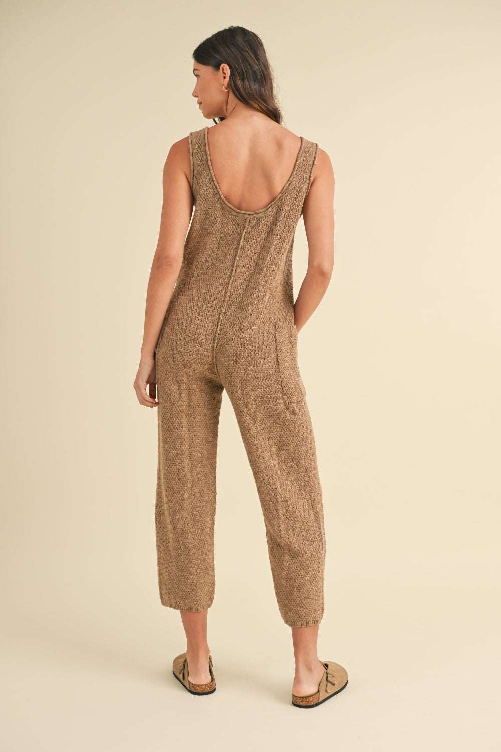 Cotton Knit JumpsuitThis sleeveless 100% cotton knit crop jumpsuit is crafted from a textured sweater knit material, offering both style and comfort. The side pocket detail adds functioJumpsuitsCotton Knit Jumpsuit