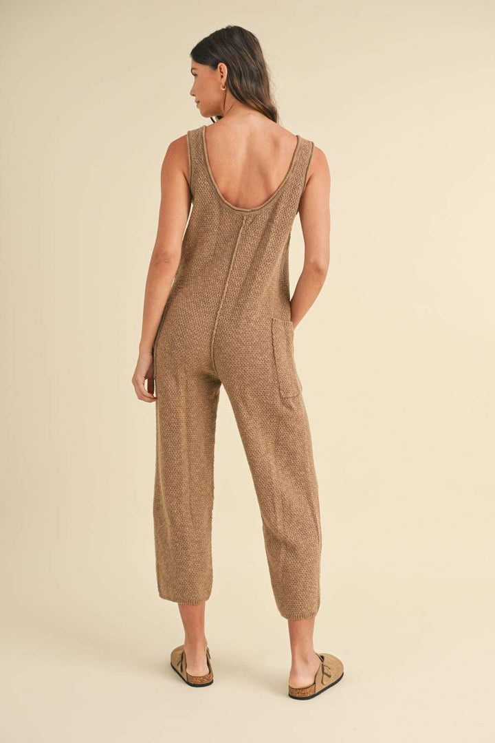 Cotton Knit JumpsuitThis sleeveless 100% cotton knit crop jumpsuit is crafted from a textured sweater knit material, offering both style and comfort. The side pocket detail adds functioJumpsuitsCotton Knit Jumpsuit