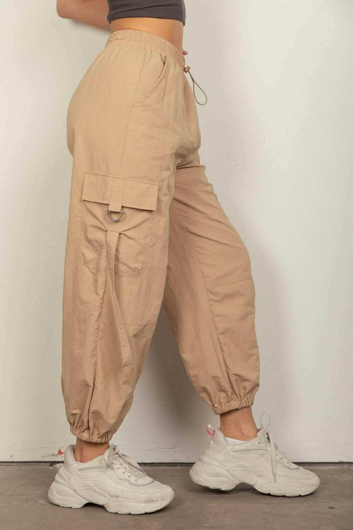 Desert Cargo JoggersStay on-trend with these Y2K-inspired elastic waist solid cargo joggers featuring a utility design perfect for everyday wear. The side pockets and D rings add a toucPantsDesert Cargo Joggers