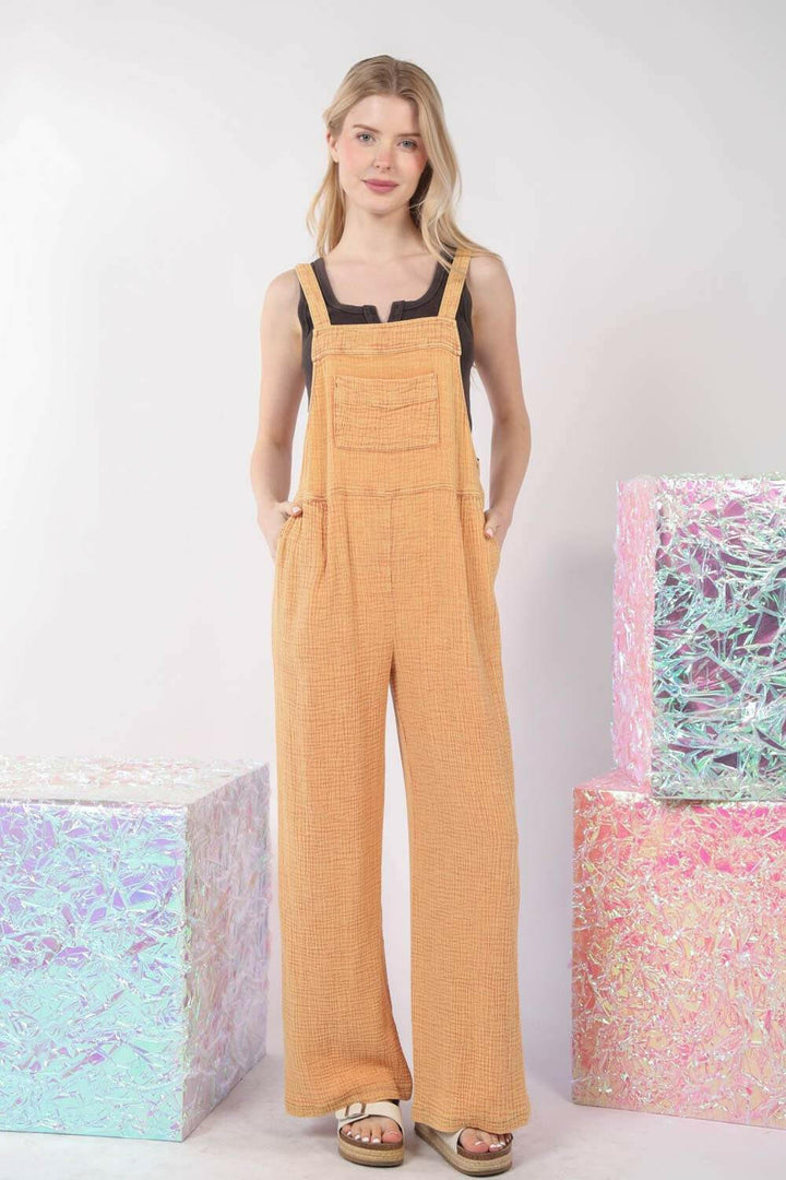 Textured Cotton Overalls - TangerineStep into sunny days with our Tangerine Cotton Overalls. This vibrant piece is designed with a relaxed, wide-leg fit and a classic square neckline, making it perfectOverallsTextured Cotton Overalls