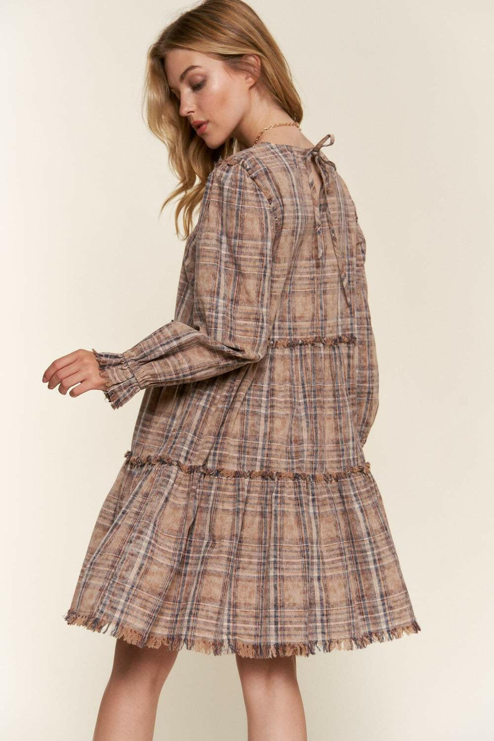 Tiered Plaid DressThe Tiered Plaid Dress is a charming and stylish addition to your wardrobe. With its unique tiered design and frayed detailing, this dress exudes a trendy and bohemiMini DressesTiered Plaid Dress