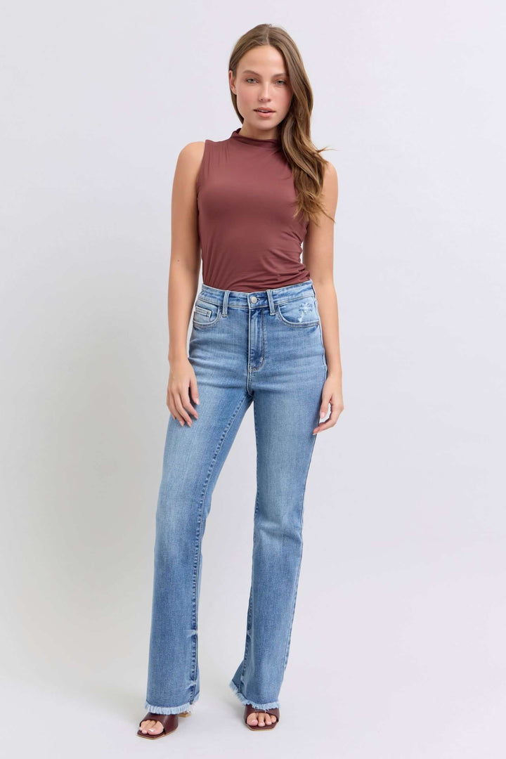 Judy Blue Raw Hem High Rise Bootcut JeansRaw hem high rise bootcut jeans are a trendy and stylish denim option for a fashionable look. These jeans typically feature a high-rise waist that sits above the natBootcut JeansJudy Blue Raw Hem