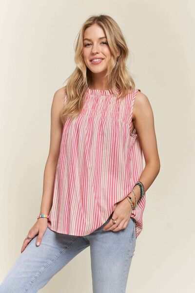 Striped Smocked Linen-Blend TopThe Striped Smocked Linen-Blend Top is a chic and feminine piece that combines classic stripes with trendy details. The contrast stripes add a stylish touch to the dSleeveless BlousesStriped Smocked Linen-Blend Top