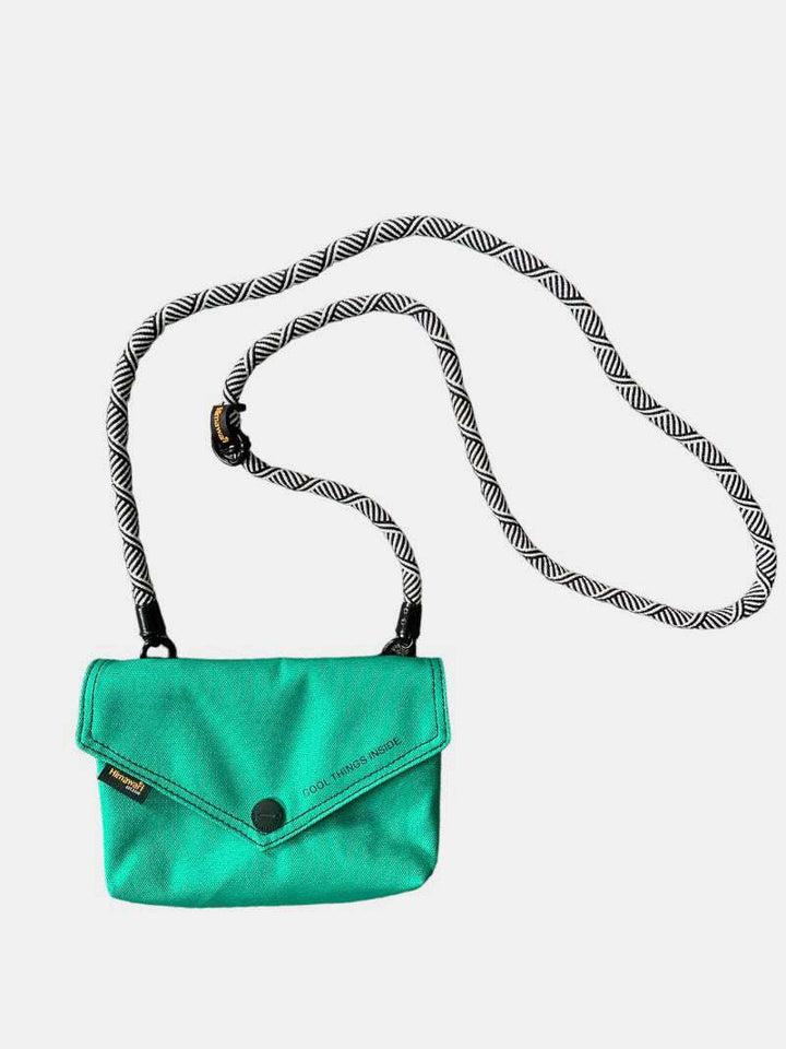 Himawari Solid Color Envelope Shape Crossbody Bag with Removable StrapThe solid color envelope shape crossbody bag with removable strap is a versatile and stylish accessory for any outfit. Its sleek design and solid color make it efforCrossbody BagsHimawari Solid Color Envelope