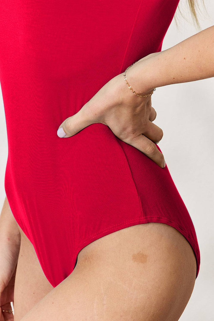 Round Neck Short Sleeve BodysuitBrand: Basic Bae 
Fit: True to size
Features: Basic style
Sheer: Opaque
Stretch: Moderate stretch
Material composition: 95% rayon, 5% spandex
Care instructions: MachBodysuitsRound Neck Short Sleeve Bodysuit