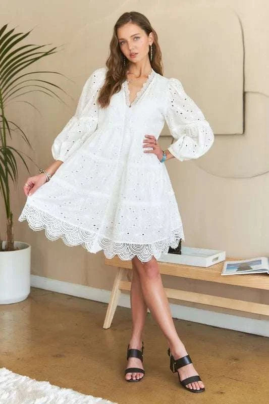 Lace Detail Tiered Eyelet V-Neck Babydoll DressA Lace Detail Tiered Eyelet V-Neck Babydoll Dress is a charming and elegant piece for your wardrobe. The V-neckline and babydoll silhouette offer a flattering and feMini DressesLace Detail Tiered