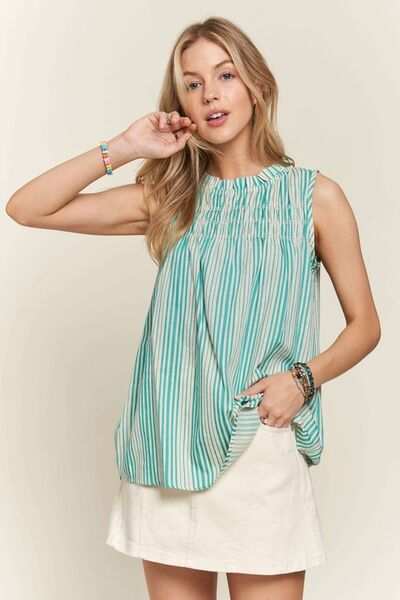 Striped Smocked Linen-Blend TopThe Striped Smocked Linen-Blend Top is a chic and feminine piece that combines classic stripes with trendy details. The contrast stripes add a stylish touch to the dSleeveless BlousesStriped Smocked Linen-Blend Top