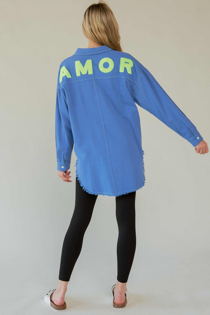 Amor Oversized ShirtLove in every stitch. This oversized 100% cotton button-up shirt features a bold "AMOR" appliqué across the back in plush lettering, adding a playful statement to yoButton-Up ShirtsAmor Oversized Shirt