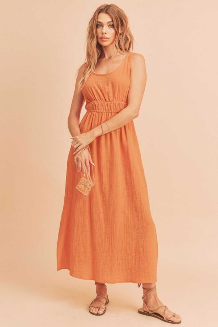 The Textured Cotton Midi Tank DressLight, breathable, and softly structured, The Textured Midi Tank Dress is crafted from a gently textured cotton that moves with ease. The sleeveless tank silhouette Midi DressesTextured Cotton Midi Tank Dress