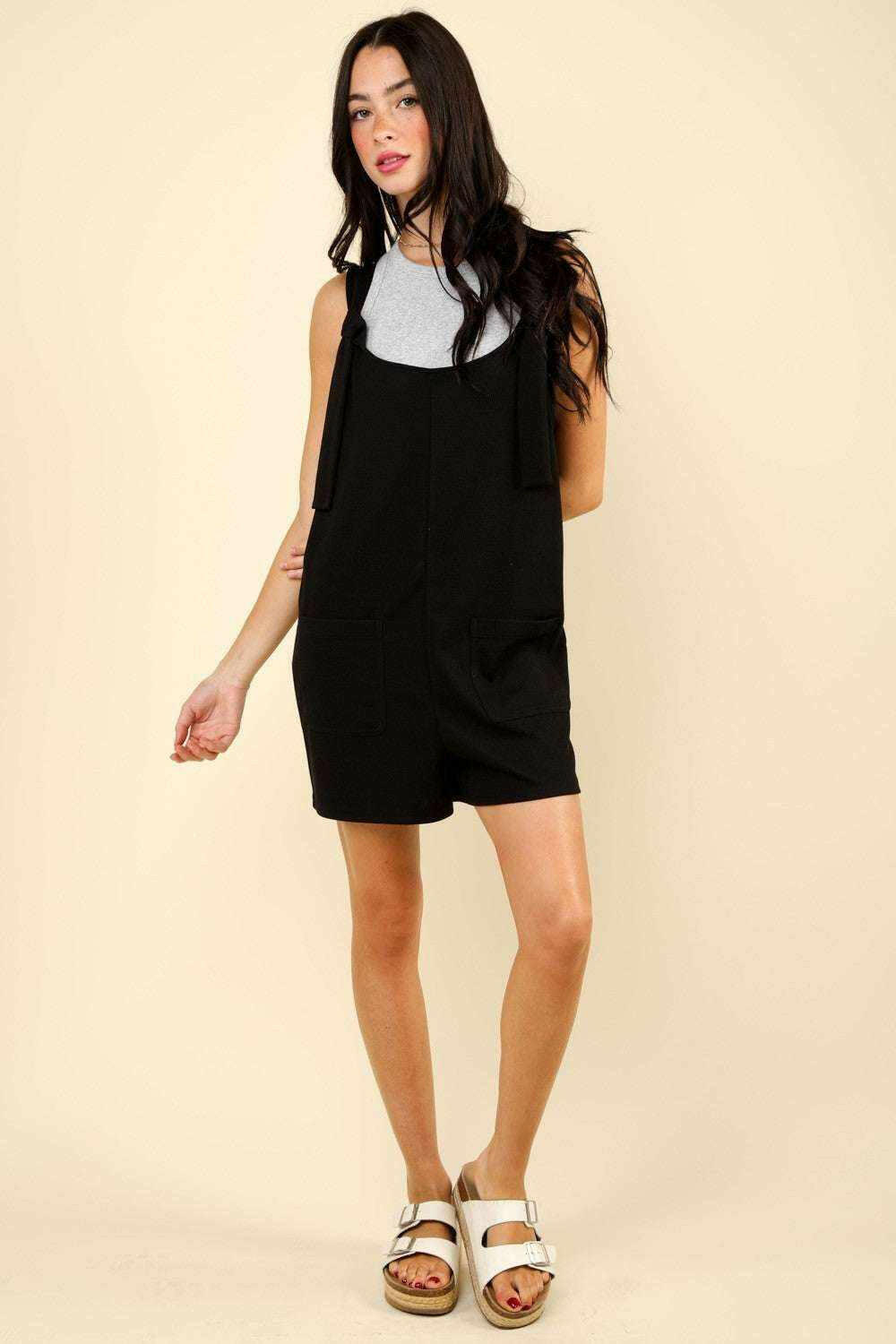 Black Tie Shoulder Front Pocket RomperThe Very J Tie Shoulder Front Pocket Romper is a trendy and comfortable option for any casual event. This cotton blend romper comes with front patch pockets for addeRompersBlack Tie Shoulder