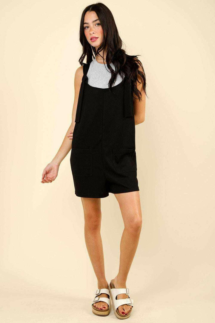 Black Tie Shoulder Front Pocket RomperThe Very J Tie Shoulder Front Pocket Romper is a trendy and comfortable option for any casual event. This cotton blend romper comes with front patch pockets for addeRompersBlack Tie Shoulder