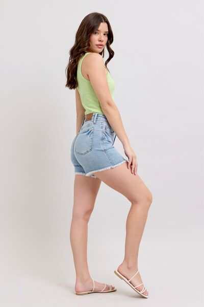 Judy Blue Tummy Control Raw Hem Denim ShortsThe tummy control raw hem denim shorts are designed to provide a slimming effect around the waist area while also featuring a trendy raw hem finish at the bottom. ThJean ShortsJudy Blue Tummy Control