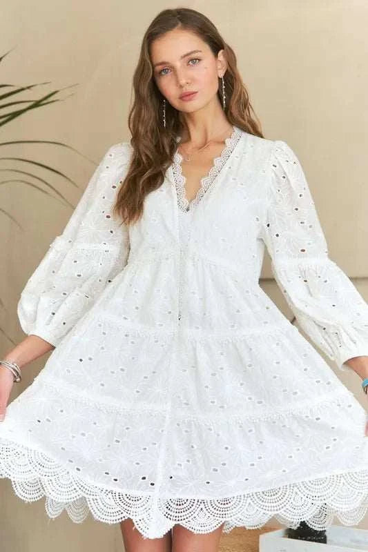 Lace Detail Tiered Eyelet V-Neck Babydoll DressA Lace Detail Tiered Eyelet V-Neck Babydoll Dress is a charming and elegant piece for your wardrobe. The V-neckline and babydoll silhouette offer a flattering and feMini DressesLace Detail Tiered