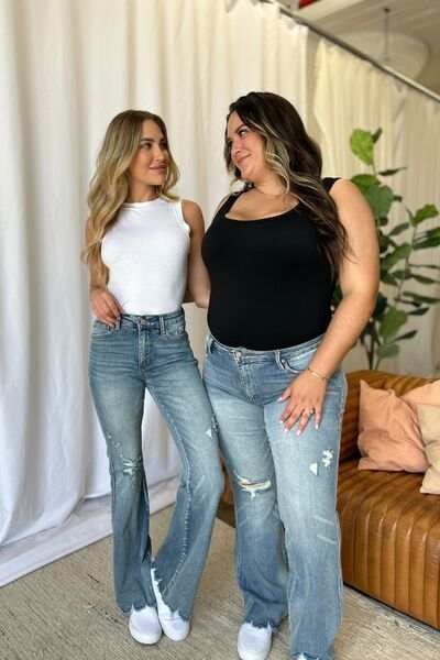 Judy Blue Medium Rise Tummy Control Destroyed FlareThe medium rise tummy control destroy flare jeans are designed to enhance your silhouette while providing ultimate comfort. Featuring a flattering fit, these jeans oFlare JeansJudy Blue Medium Rise