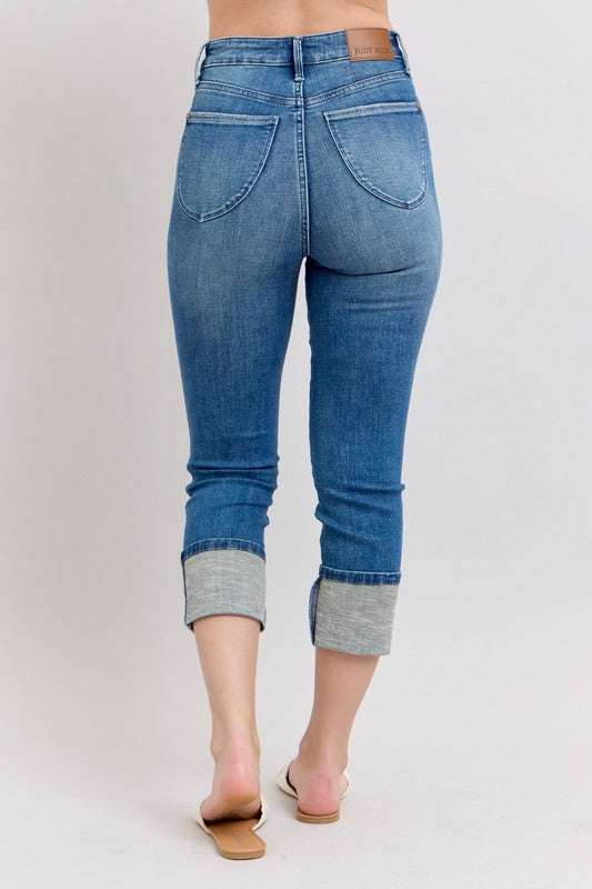 Judy Blue Skinny Cuff Capris JeansSkinny cuff capris jeans are a trendy style of jeans that are fitted through the legs and end in a cuffed hem. They are a great option for a casual and chic look, peCropped JeansJudy Blue Skinny Cuff Capris Jeans