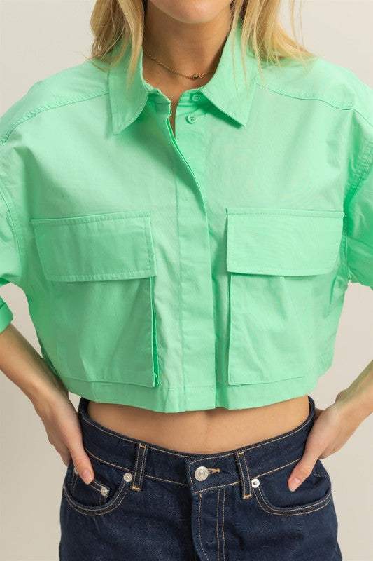 Cotton Poplin Cropped ShirtThe Cotton Poplin Cropped Shirt is a stylish and versatile piece that adds a modern twist to your wardrobe. This crop shirt features front pockets that add a utilitaCrop TopsCotton Poplin Cropped Shirt