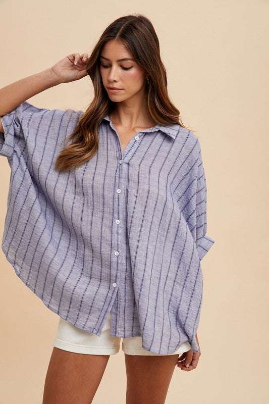 Coastal Breeze Oversized ShirtA striped button-up half sleeve shirt is a fashionable and versatile piece that can be worn in various settings. This type of shirt typically features a classic buttButton-Up ShirtsCoastal Breeze Oversized Shirt