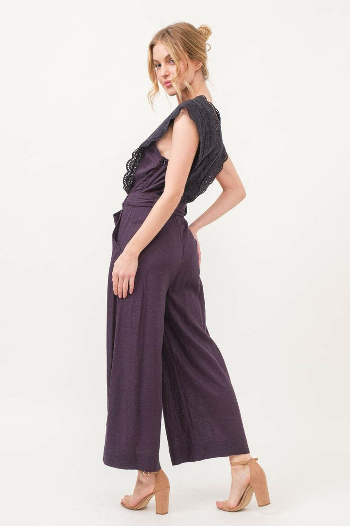 Plum Elegance Lace JumpsuitThe Plum Elegance Lace Jumpsuit is a chic and sophisticated piece that combines elegance with modern style. Featuring a laced surplice neckline and a flattering tie JumpsuitsPlum Elegance Lace Jumpsuit