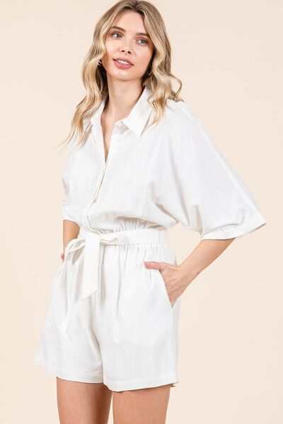 Tie Waist Linen Blend Half Sleeve RomperThe Tie Waist Linen Blend Half Sleeve Romper is a stylish and versatile one-piece outfit that exudes casual elegance. With a tie waist detail and half sleeves, this RompersTie Waist Linen Blend
