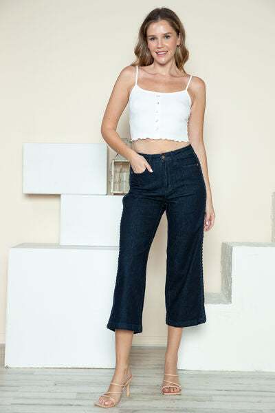 Judy Blue Side Seam Braid Detail Crop Wide Leg JeansThe High Rise side seam braid detail crop wide leg jeans offer a contemporary twist on classic denim. Featuring a unique braided detail along the side seams, these jCropped JeansJudy Blue Side Seam