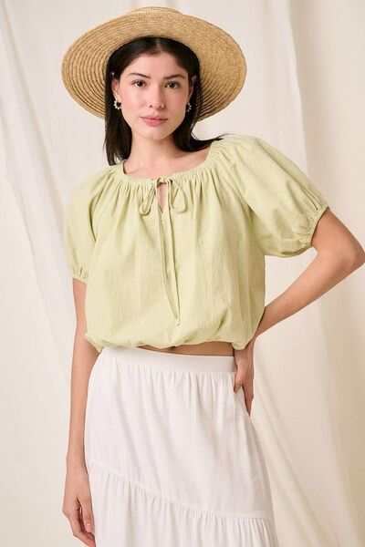 Cotton Two-Way Short Sleeve Cropped BlouseThe Cotton Two-Way Short Sleeve Crop Blouse is a versatile and chic piece that offers multiple styling options. Made from lightweight cotton fabric, this blouse is pShort Sleeve BlousesCotton Two-Way Short Sleeve