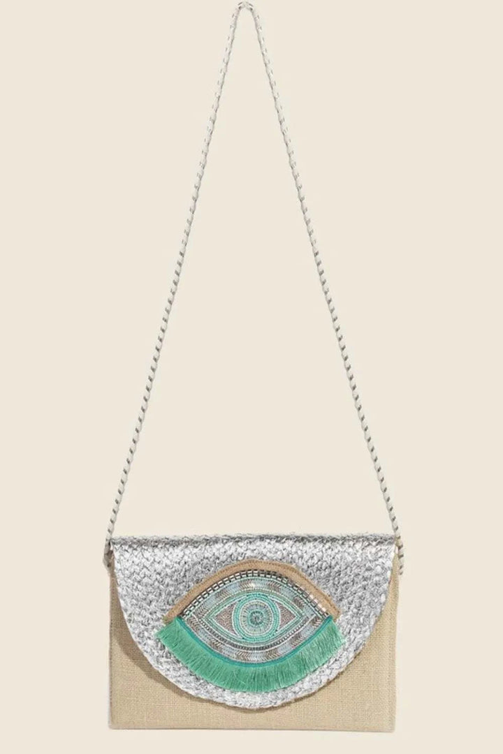 Fame Boho Beaded Eye Pattern Envelope BagThis boho beaded eye pattern envelope bag is a unique and artistic accessory that adds a touch of bohemian charm to any outfit. The intricate beadwork and eye patterHandbagsFame Boho Beaded Eye Pattern