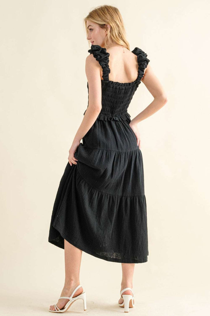 Smocked Ruffled Tiered DressThe Smocked Ruffled Tiered Dress is a charming and feminine 100% cotton piece that exudes effortless style. The smocked bodice provides a comfortable and flattering Midi DressesSmocked Ruffled Tiered Dress