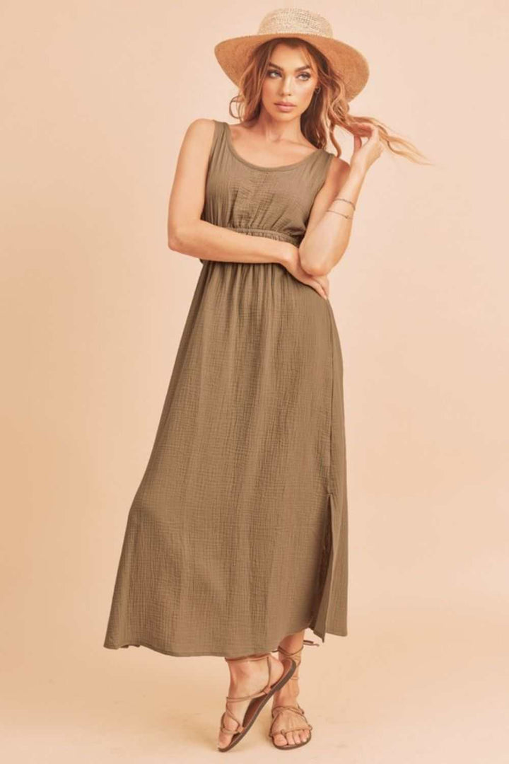The Textured Cotton Midi Tank DressLight, breathable, and softly structured, The Textured Midi Tank Dress is crafted from a gently textured cotton that moves with ease. The sleeveless tank silhouette Midi DressesTextured Cotton Midi Tank