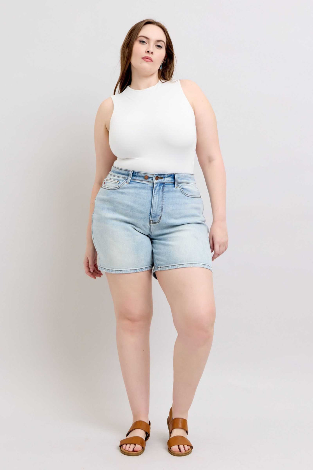 Judy Blue Two Button Denim ShortsThese 2-button denim shorts are a stylish addition to your wardrobe. They feature pockets for your convenience and added functionality. Made from durable denim fabriJean ShortsJudy Blue Two Button Denim Shorts