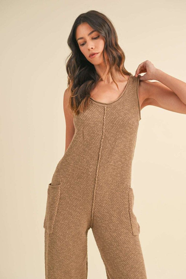 Cotton Knit JumpsuitThis sleeveless 100% cotton knit crop jumpsuit is crafted from a textured sweater knit material, offering both style and comfort. The side pocket detail adds functioJumpsuitsCotton Knit Jumpsuit