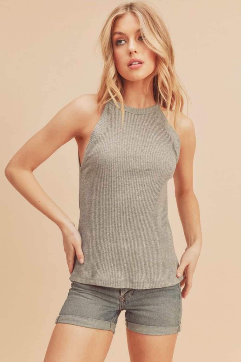 Ribbed Round Neck TankThe Ribbed Round Neck Tank is a classic and versatile piece that belongs in every wardrobe. Featuring a round neckline and ribbed texture, this tank top offers a timTank TopsRibbed Round Neck Tank