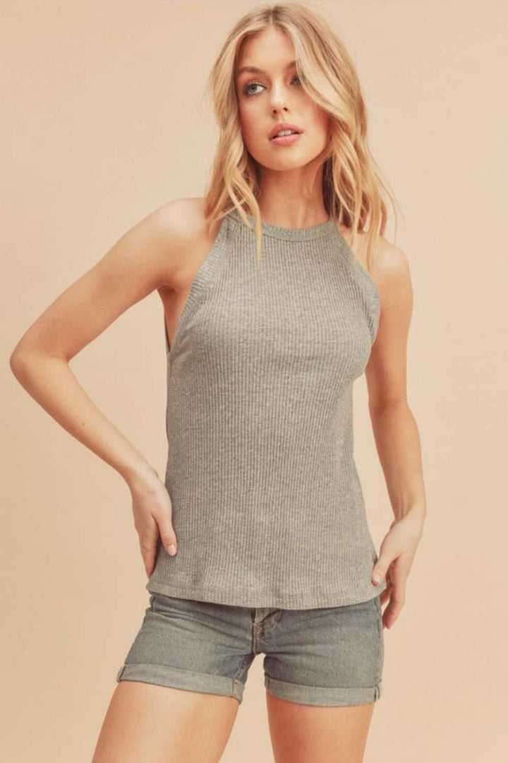 Ribbed Round Neck TankThe Ribbed Round Neck Tank is a classic and versatile piece that belongs in every wardrobe. Featuring a round neckline and ribbed texture, this tank top offers a timTank TopsRibbed Round Neck Tank