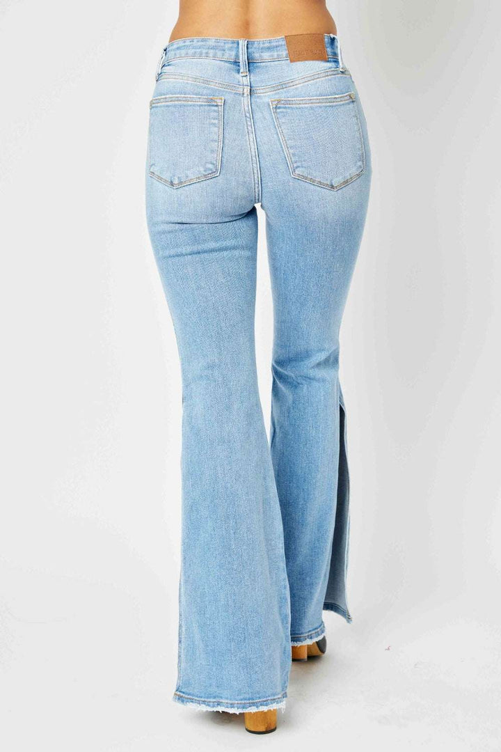 Judy Blue Mid Rise Raw Hem Slit Flare JeansThese jeans offer a flattering silhouette that hugs your curves in all the right places while providing a relaxed, retro-inspired flare at the hem. The versatile ligFlare JeansJudy Blue Mid Rise
