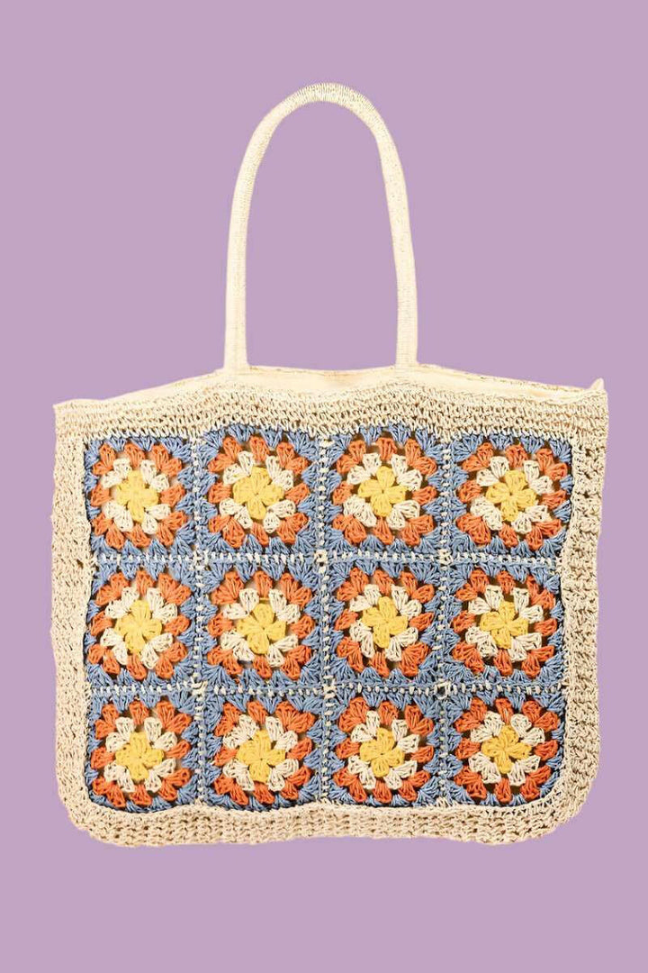 Granny Square Tote BagThe Granny Square Tote Bag is a delightful and stylish accessory that adds a touch of bohemian flair to any outfit. Its intricate braided detailing and floral embellTote BagsGranny Square Tote Bag