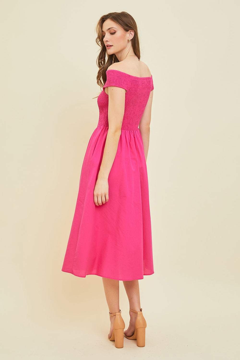 Off-Shoulder Smocked Midi DressThe 100% cotton Off-Shoulder Smocked Midi Dress is a stylish and versatile piece that is perfect for warm weather. Featuring an off-shoulder design and a smocked bodMidi DressesOff-Shoulder Smocked Midi Dress