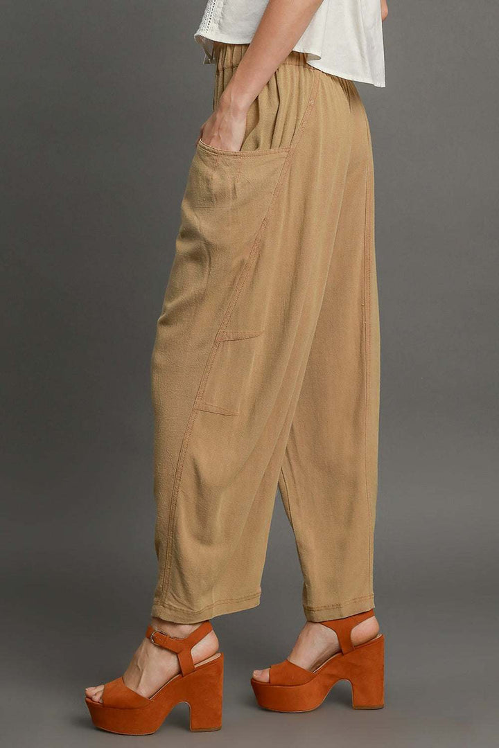 The Sandbar Linen Blend TrousersEasy, breathable, and softly structured — The [NAME] Trousers are crafted from a natural linen-cotton blend that moves effortlessly through warm days and cooler evenPantsSandbar Linen Blend