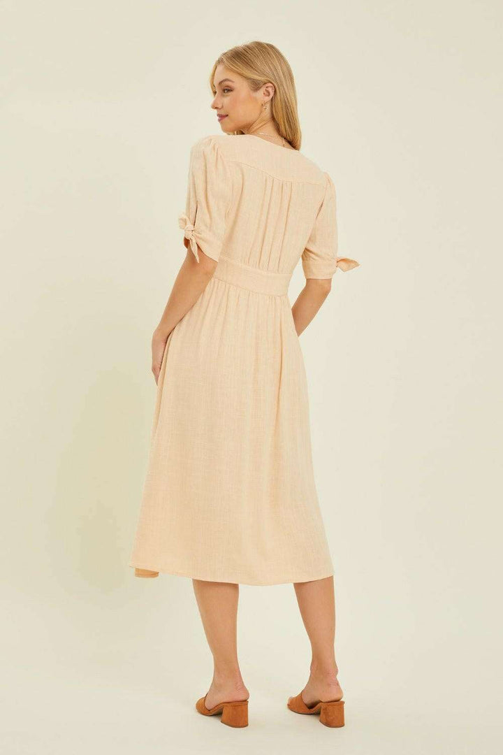 Linen-Blend Button-Down Midi DressThe Linen-Blend Button-Down Midi Dress is a classic yet stylish choice for any occasion. This dress features a flattering V-neckline and a button-down front for a tiMidi DressesLinen-Blend Button-Down Midi Dress