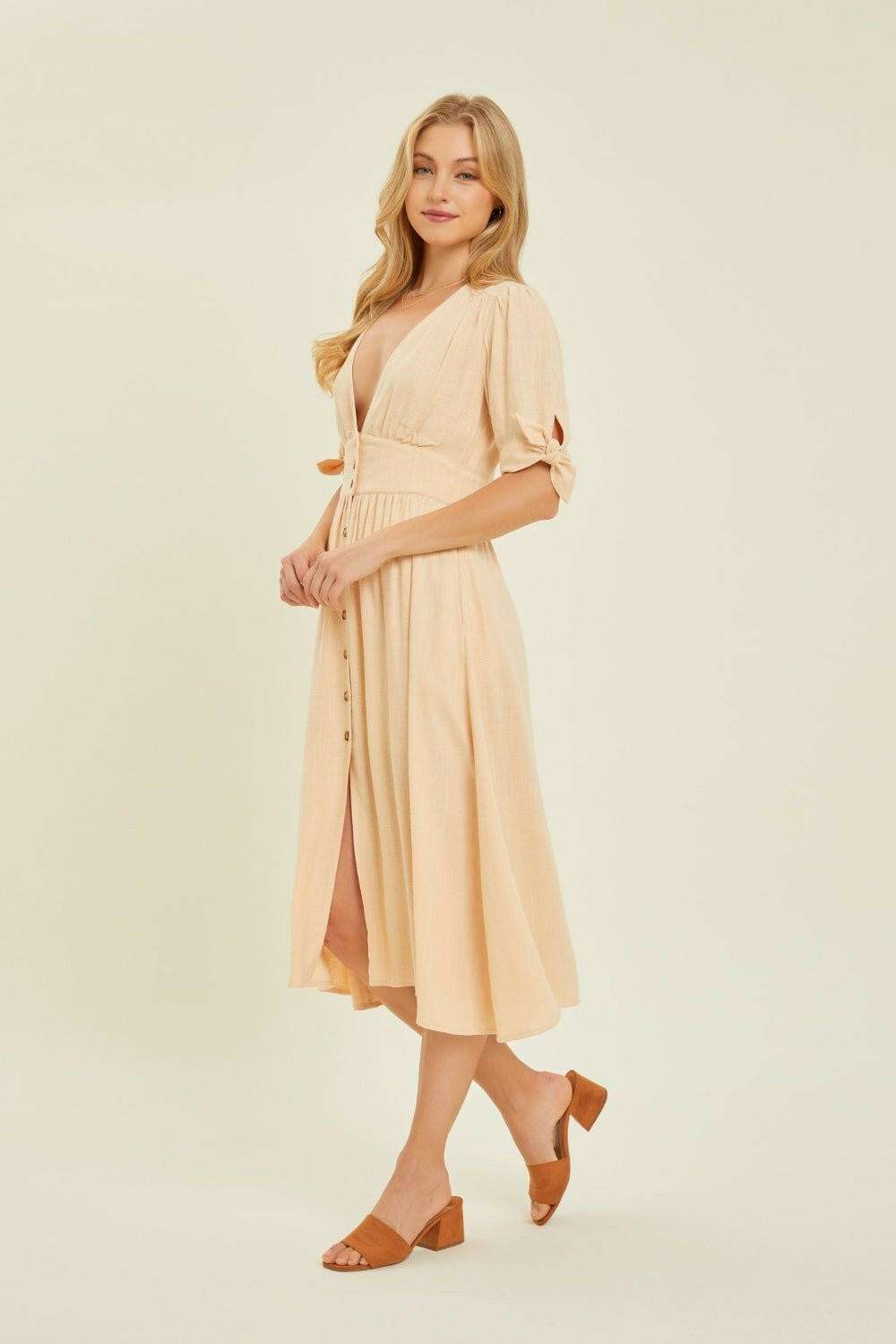 Linen-Blend Button-Down Midi DressThe Linen-Blend Button-Down Midi Dress is a classic yet stylish choice for any occasion. This dress features a flattering V-neckline and a button-down front for a tiMidi DressesLinen-Blend Button-Down Midi Dress