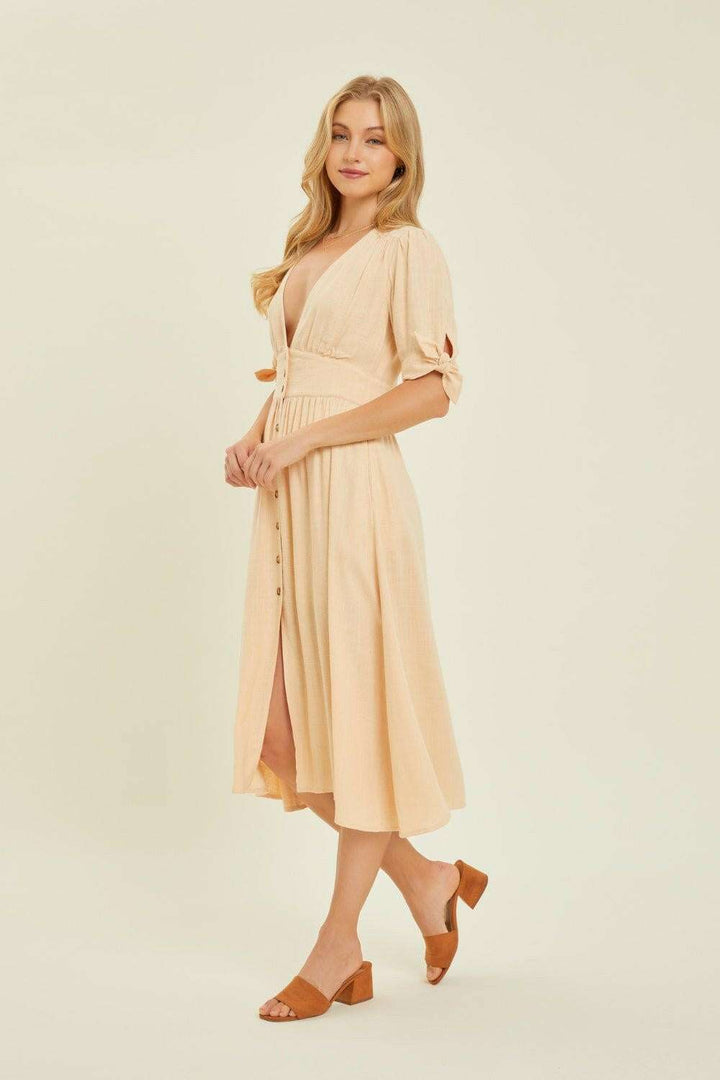 Linen-Blend Button-Down Midi DressThe Linen-Blend Button-Down Midi Dress is a classic yet stylish choice for any occasion. This dress features a flattering V-neckline and a button-down front for a tiMidi DressesLinen-Blend Button-Down Midi Dress