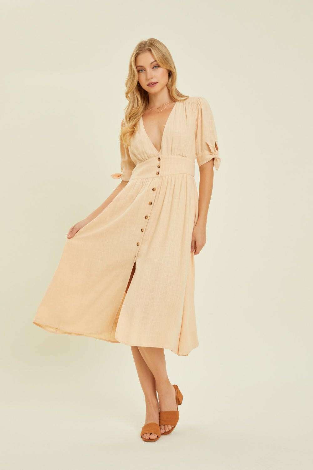 Linen-Blend Button-Down Midi DressThe Linen-Blend Button-Down Midi Dress is a classic yet stylish choice for any occasion. This dress features a flattering V-neckline and a button-down front for a tiMidi DressesLinen-Blend Button-Down Midi Dress