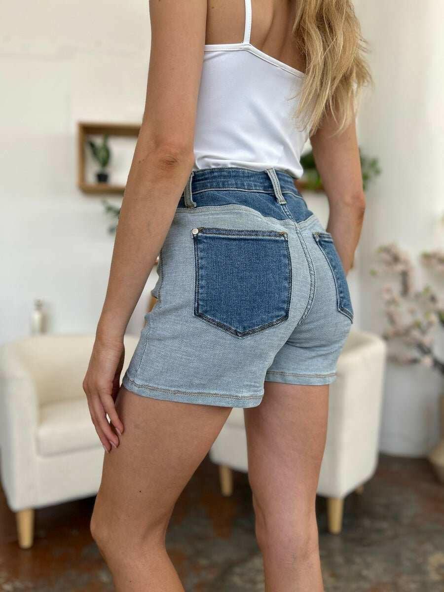 Judy Blue Color Block Denim ShortsStep into summer with an exclusive touch of modern flair featuring the Judy Blue Color Block Denim Shorts. Designed for trendsetters who demand both style and comforJean ShortsJudy Blue Color Block Denim Shorts