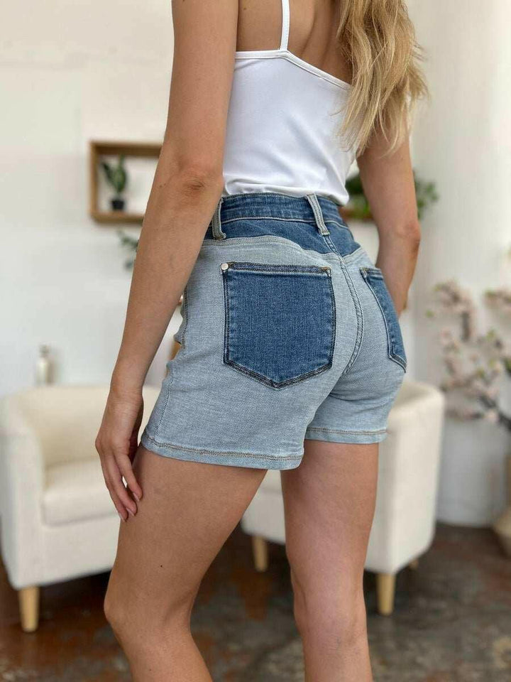 Judy Blue Color Block Denim ShortsStep into summer with an exclusive touch of modern flair featuring the Judy Blue Color Block Denim Shorts. Designed for trendsetters who demand both style and comforJean ShortsJudy Blue Color Block Denim Shorts
