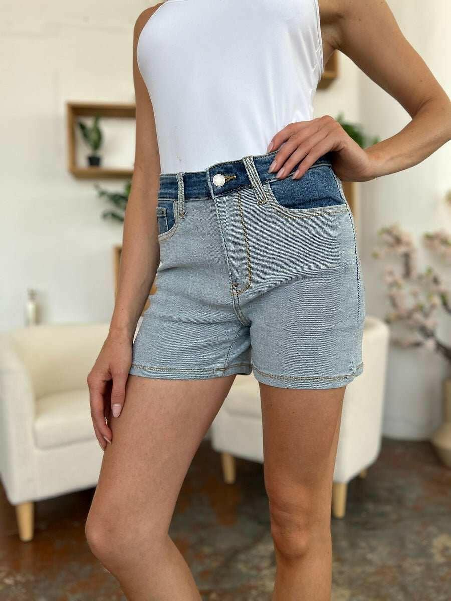 Judy Blue Color Block Denim ShortsStep into summer with an exclusive touch of modern flair featuring the Judy Blue Color Block Denim Shorts. Designed for trendsetters who demand both style and comforJean ShortsJudy Blue Color Block Denim Shorts