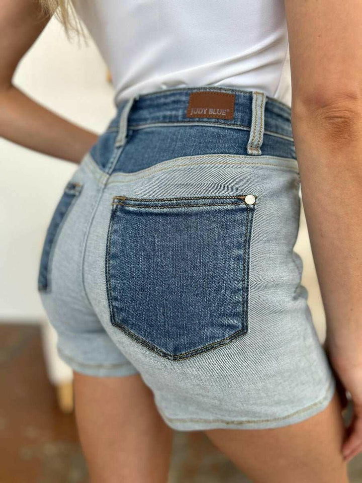 Judy Blue Color Block Denim ShortsStep into summer with an exclusive touch of modern flair featuring the Judy Blue Color Block Denim Shorts. Designed for trendsetters who demand both style and comforJean ShortsJudy Blue Color Block Denim Shorts