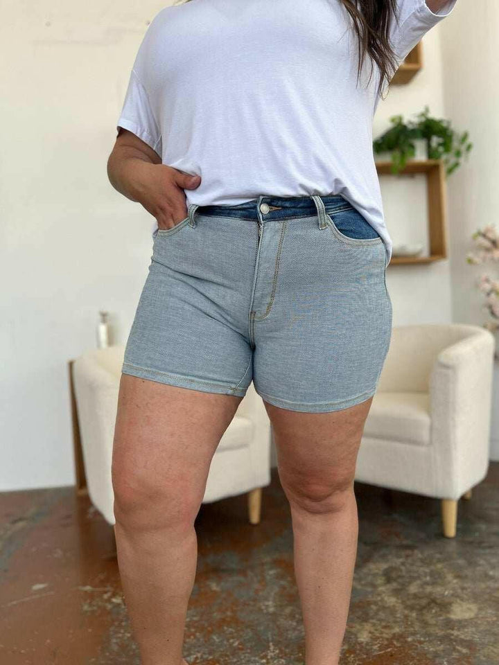 Judy Blue Color Block Denim ShortsStep into summer with an exclusive touch of modern flair featuring the Judy Blue Color Block Denim Shorts. Designed for trendsetters who demand both style and comforJean ShortsJudy Blue Color Block Denim Shorts