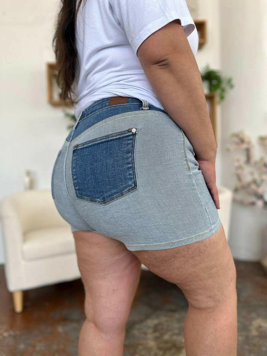 Judy Blue Color Block Denim ShortsStep into summer with an exclusive touch of modern flair featuring the Judy Blue Color Block Denim Shorts. Designed for trendsetters who demand both style and comforJean ShortsJudy Blue Color Block Denim Shorts