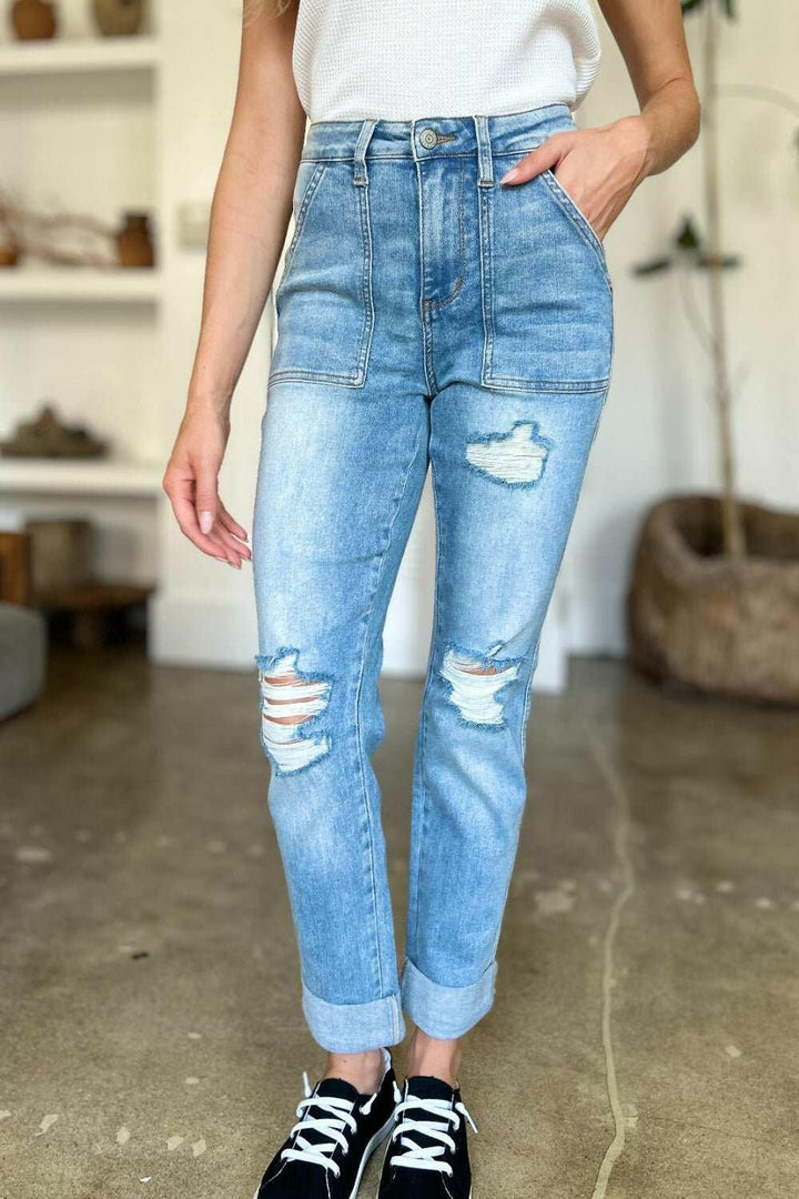 Judy Blue Distressed Straight Leg Jeans with Patch PocketsThese distressed straight jeans feature stylish patch pockets for added flair. The distressed detailing adds a trendy touch to your look. The straight cut offers a fStraight Leg JeansJudy Blue Distressed
