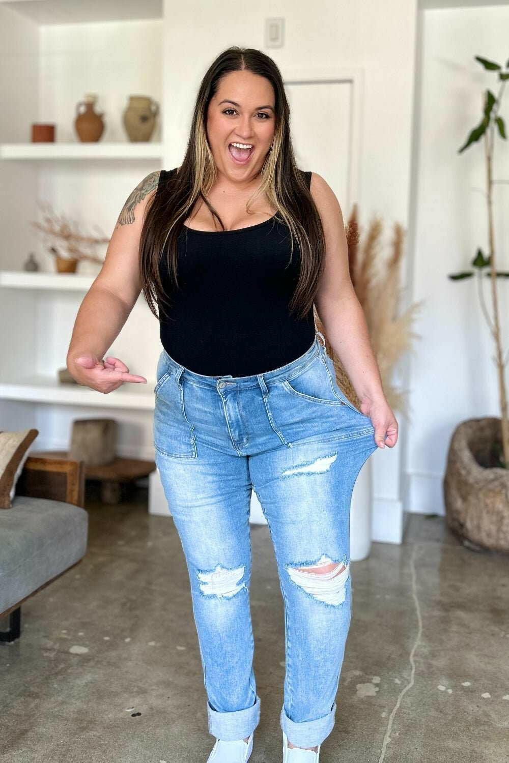 Judy Blue Distressed Straight Leg Jeans with Patch PocketsThese distressed straight jeans feature stylish patch pockets for added flair. The distressed detailing adds a trendy touch to your look. The straight cut offers a fStraight Leg JeansJudy Blue Distressed
